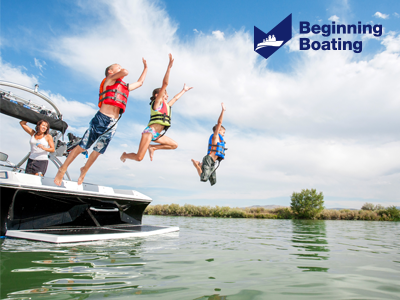 Kids jumping off a boat into the water
